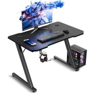 TRIUMPHKEY Mesa Gaming 80 x 52 cm, Escritorio Gaming en Forma de Z Ergonómica, Mesa Gamer de Fibra de Carbono, Mesa para Ordenador con Gancho para Auriculares, Negro